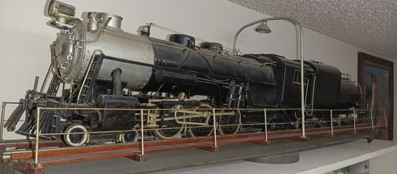 It is an antique, over 100 years old, custom built in 1919. It is approximately 5ft long on a turn table and it moves back and forth, very fragile, as