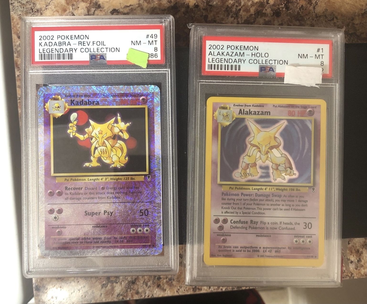 PSA 8 Alakazam and Reverse Holo Kadabra