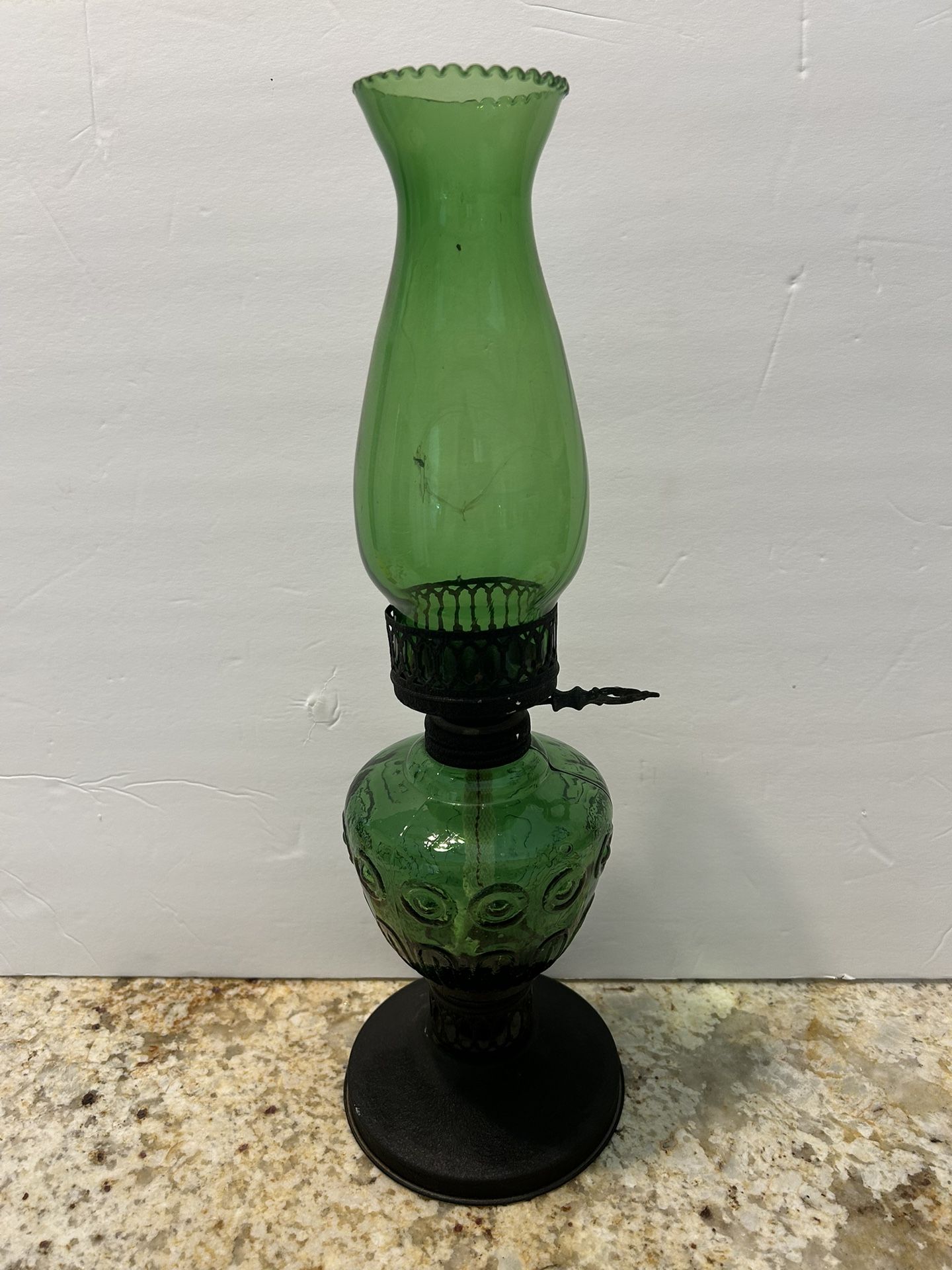 Antique green oil lamp