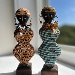 "Set of 2 Handcrafted Beaded Figurines with Shell and Fabric Accents"  It Represents The African Woman