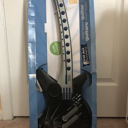 A Kids guitar, Toy Story Carryon, And Kid’s Fish Wall Decoration.
