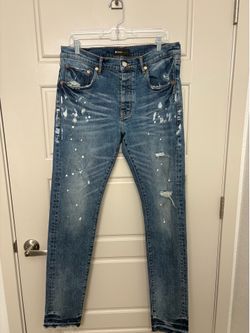 Purple Brand distressed paint-splatter jeans,
