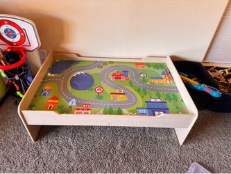 Wooden table with train set