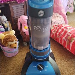 Hoover vacuum cleaner, with book and I'll attachments