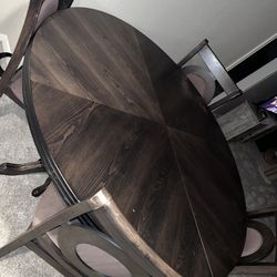 Big Brown Wooden Table With Four Chairs