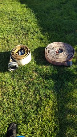 two industrial flat hoses  snap tite supply hose 25ft and 50ft