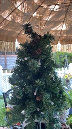 Adorable 33 inch Christmas Tree that can be used on the ground or a planter.