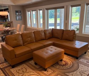 Carmel leather sectional couch and ottoman