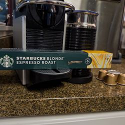 Nespresso Pixie espresso machine and Milk Frother with pods