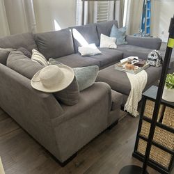 Grey sectional with ottoman