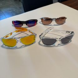 4 pairs of Oakley glasses