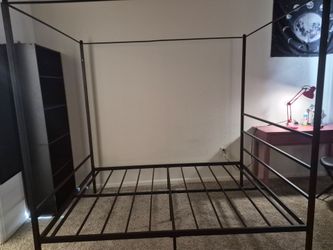 Full size canopy bed frame black.