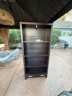 Brown bookshelf with storage