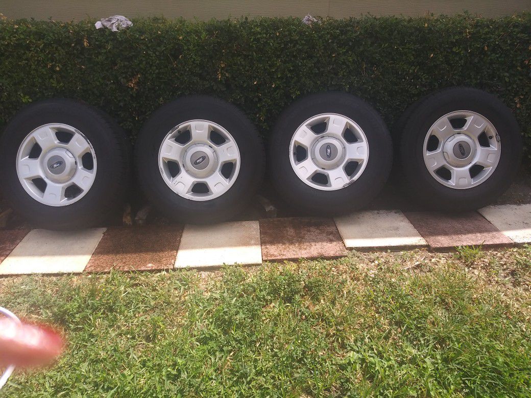 Selling 4 OEM stock F150 rims 17 inch 6 lug with 1month old lion sport H\T 265\65\R17 comes with caps&nuts 450.00 OBO