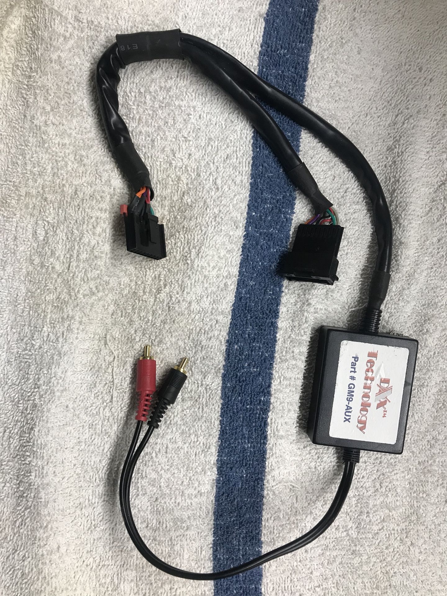 Plug-in stock GM radio interface for auxiliary input