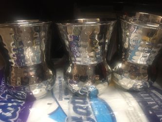 Three decorative cup- like