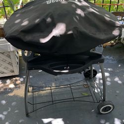 Weber Portable Gas Grill On Movable Cart With A Weber Grill Cover