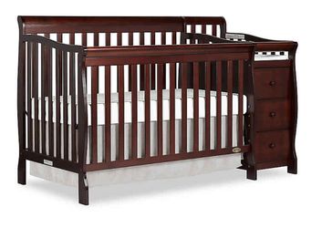 Baby crib with changing table