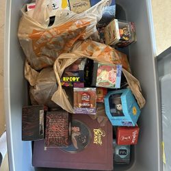 Disney - box of random Disney collectibles. 30+ Vinylmations, Beauty and the Beast ornament set NIB, lunch boxes, a puzzle, mug, cutting board, etc 