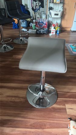 Grey swerving chair