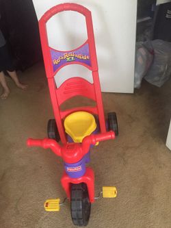 Red and yellow Fisher-Price Rock Roll Ride