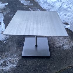 industrial -style square stainless steel bistro table with a pedestal base 36’x 36’ 28’H