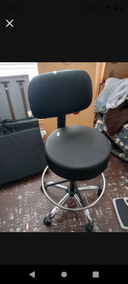 Sturdy Black Leather Roller Chair Ready For A Desk Or For Playing An Instrument
