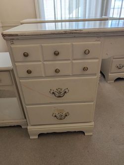 Two dressers, one desk, and nightstand