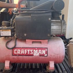  Craftsman portable air compressor, likely a 3-gallon model or similar based on its size and design.  