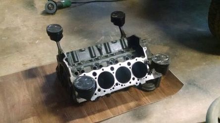 V8 motor table with glass top