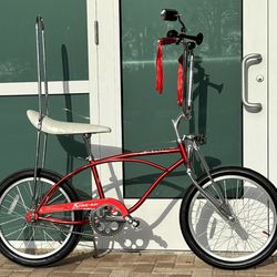 Schwinn Sting-Ray Beautiful Red W/Tall sissy bar and accessories (display only) in air-conditioning,