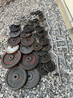 Weight 250 lbs and Plates with Barbells
