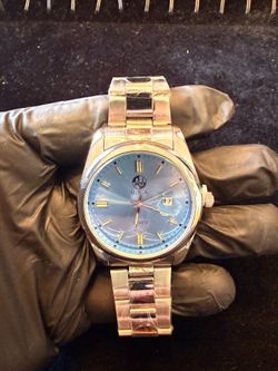 Stainless steel baby blue dial watch