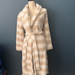 Cozy Striped Fleece Robe Soft and plush fleece robe. Features a stylish striped pattern. Perfect for lounging.