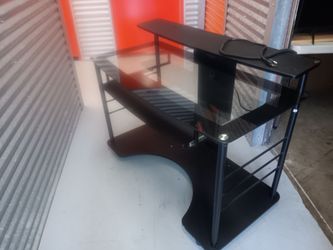 Selling glass top desk with 2 USB plug ins and on rollers