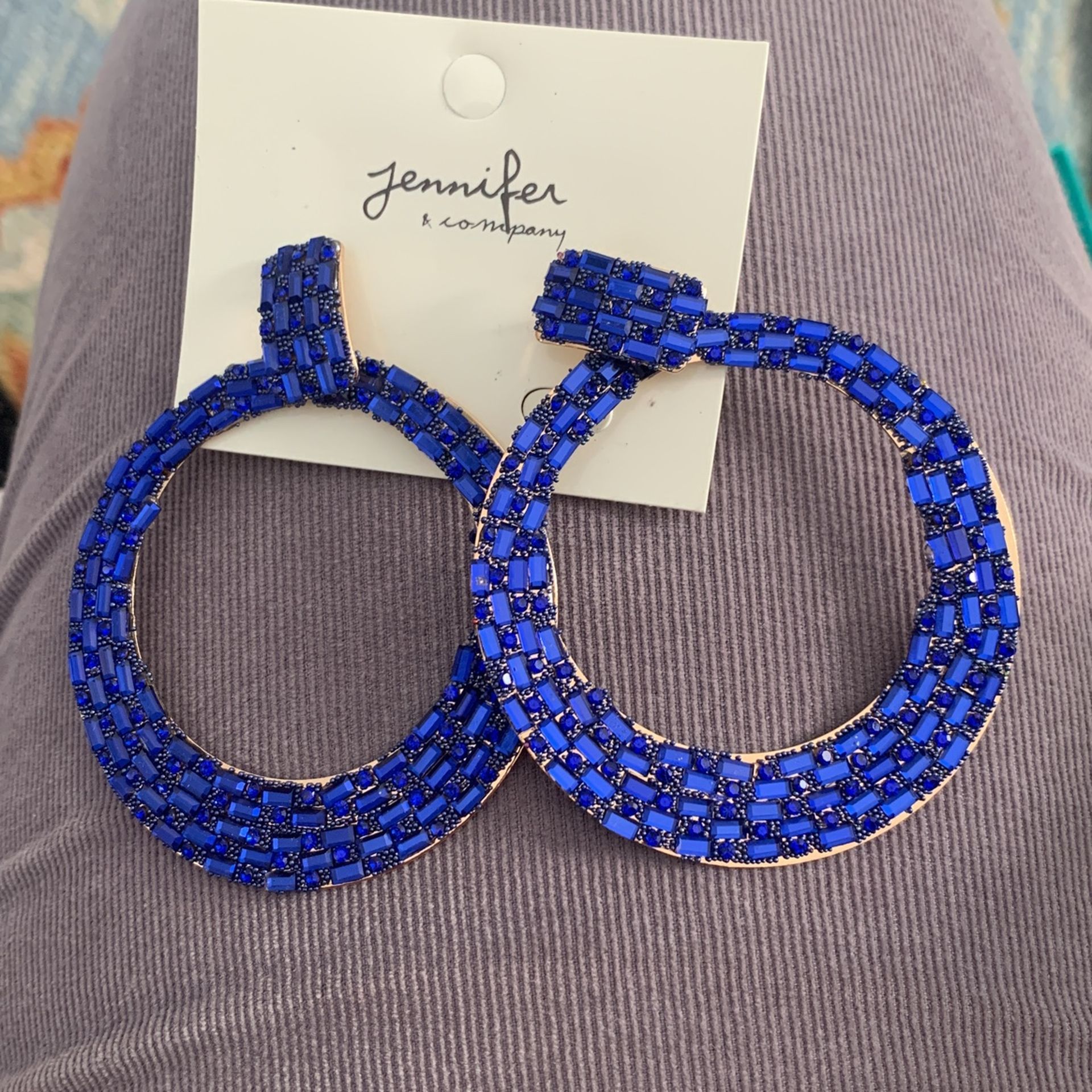 Sparkle and shine with these stunning Blue Rhinestone Hoop Earrings by Jennifer & Co.!