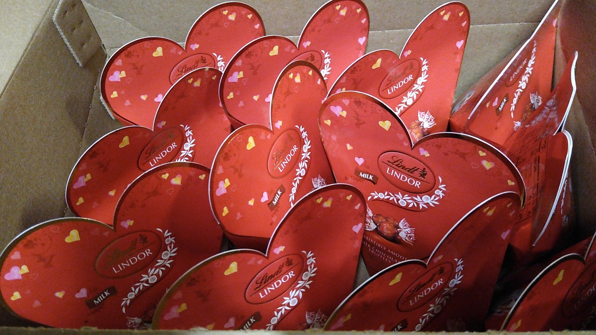 Lindt milk chocolate balls mini hearts . 2 oz