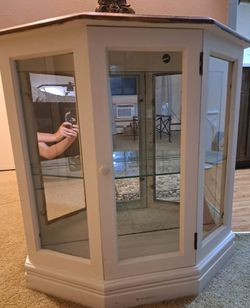 For sale a Charming hexagonal corner curio display cabinet