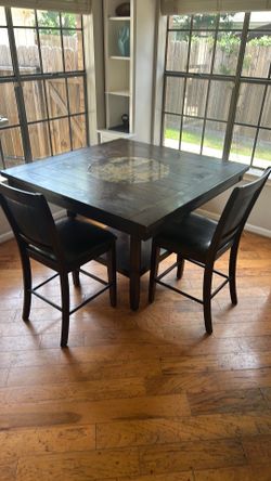Dining room table with two chairs