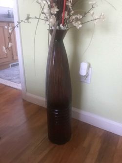 Metallic vase and decorative florals included