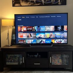 contemporary and elegant TV stand tailored for TVs Crafted to seamlessly blend into any bedroom or family room, this masterpiece combines modern aesth