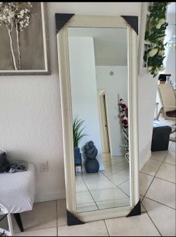 Elegant white framed mirror, perfect for any room.