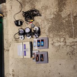 Super Nintendo System With Games And 3 Remotes