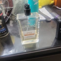 Half-used Cremo Spice & Black Vanilla cologne spray.