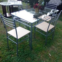 ** GLASS DINING TABLE WITH 4 CHAIRS** $125 OBO