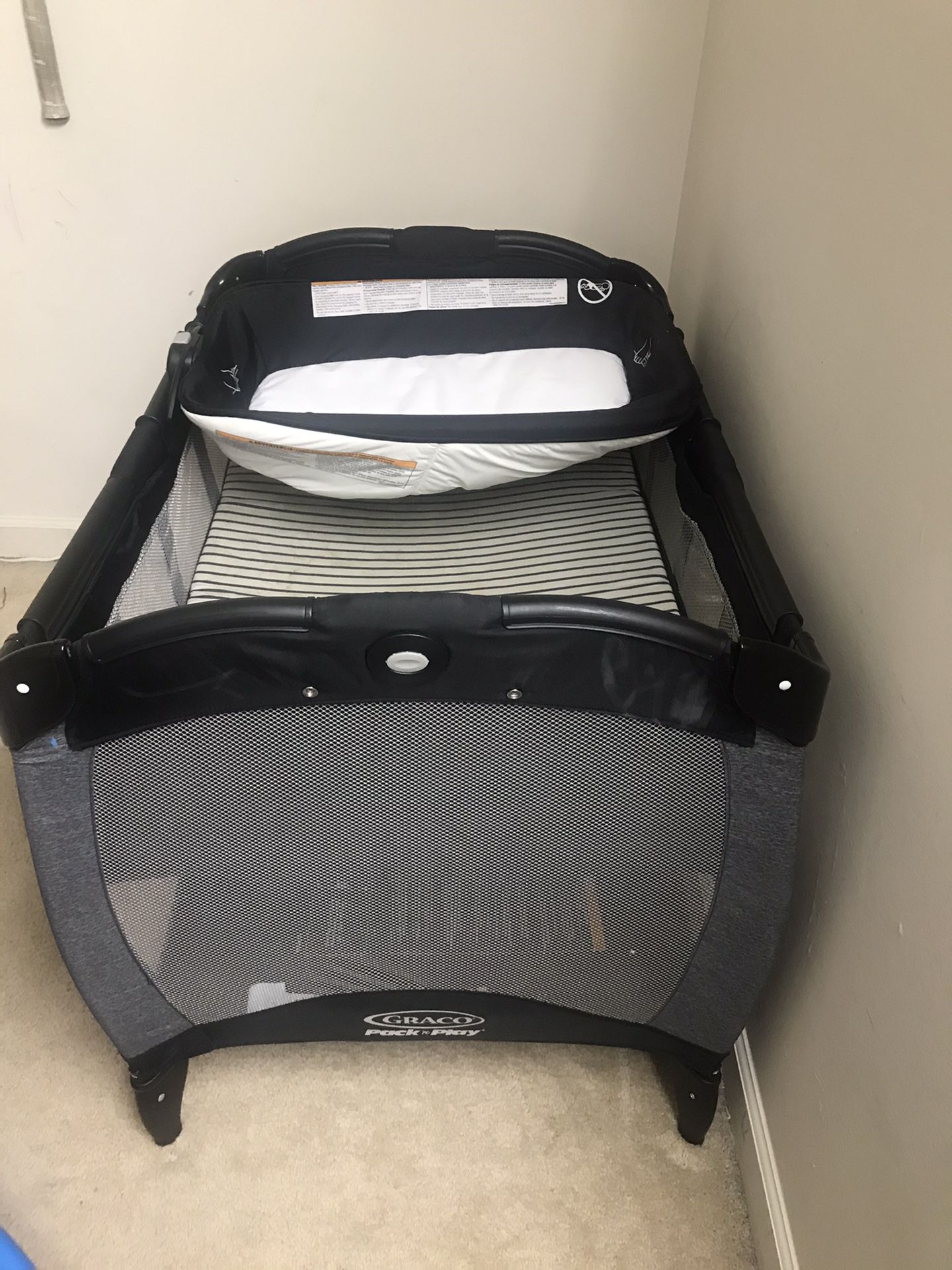 Graco Pack and Play with reversible diaper changer and seater