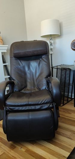Massage chair/Lounger with rising leg rest.
