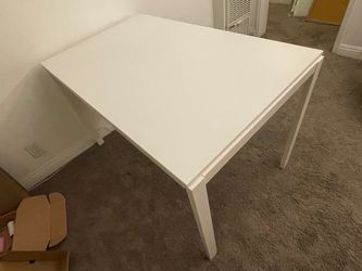 White IKEA extendable table.