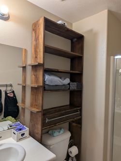Large brown wooden bathroom shelf storage with drawer