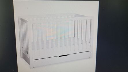 Convertible crib with storage drawer